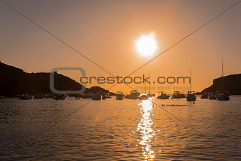Sailboats in a harbor at sunset. Mediterranean sea of Ibiza island