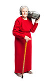Senior woman listening to music while carrying stereo recorder