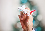 Closeup of man hand holding model of airplane