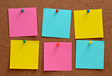 Blank notes pinned into brown corkboard