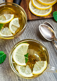 Cup with mint and lemon tea