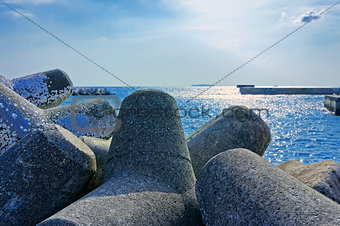 Seaside with concrete breakwater tetrapod