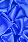 Smooth elegant blue silk as background 