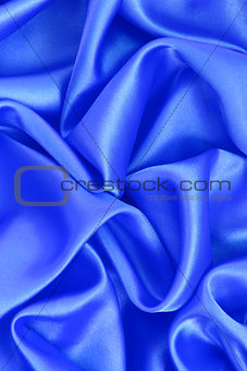 Smooth elegant blue silk as background 