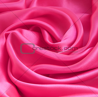 Smooth pink silk as background 