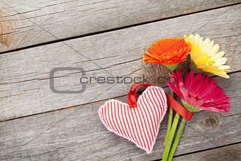 Colorful gerbera flowers and Valentine's day heart