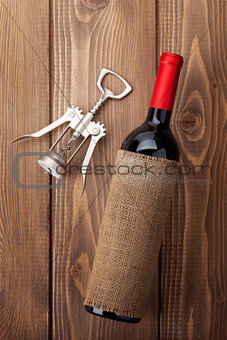 Red wine bottle and corkscrew