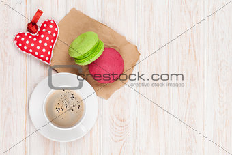Coffee cup, colorful macarons and valentines day gift toy