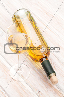White wine glass and bottle