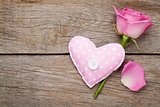 Valentines day background with pink rose and handmaded toy heart