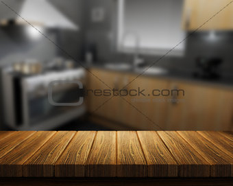 Wooden table with kitchen in background
