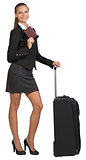 Businesswoman with suitcase and passport