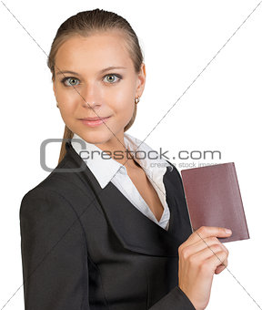 Businesswoman showing passport with blank cover
