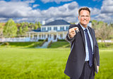 Real Estate Agent with House Keys in Front of Home