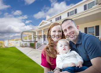 Young Military Family in Front of Beautiful House