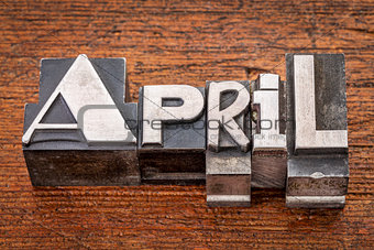 April word in metal type