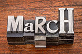 March word in metal type