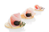 Luxurious canape with ham.