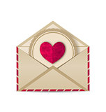 Paper grunge heart in open old envelope