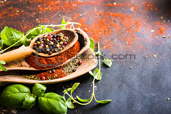wooden spoons with spices and herbs
