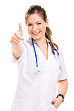 Beautiful young veterinary with thumbs up, isolated over white b