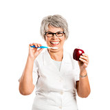 Elderly woman brushing her teeth
