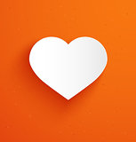 White paper heart on orange background