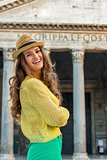 Portrait of smiling young woman in front of pantheon in rome, it