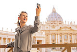 Young woman making selfie on piazza san pietro in vatican city s