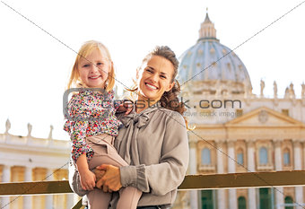 Portrait of happy mother and baby girl on piazza san pietro in v