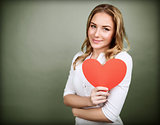 Cute girl with red paper heart