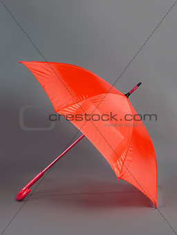 red umbrella on a gray background
