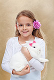 Cute little girl with her rabbit