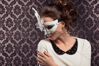 carnival masked girl in elegant dress