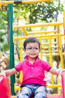 Asian boy relax in the park