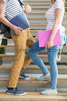 Students standing on steps together