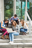 Students sitting on steps studying