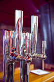Shiny beer taps in a row
