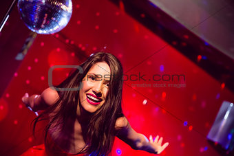 Pretty brunette dancing and smiling
