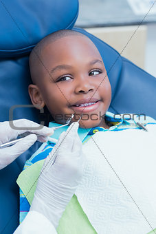 Close up of boy having his teeth examined