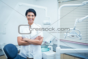 Female dentist with arms crossed