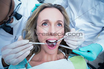 Close up of woman having her teeth examined