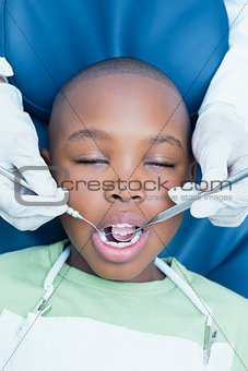 Close up of boy having his teeth examined