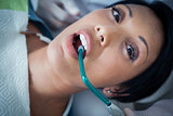 Close up of woman having her teeth examined