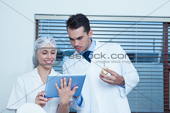 Dentists using digital tablet