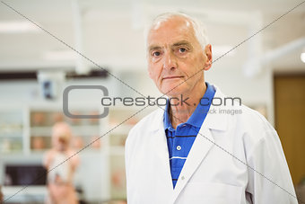 Senior scientist looking at camera
