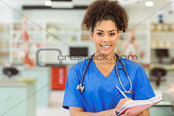 Young medical student smiling at camera