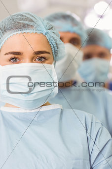 Team of surgeons looking at camera