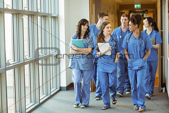 Medical students walking through corridor