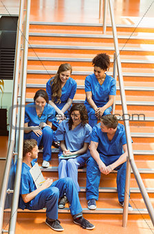 Medical students chatting on the steps